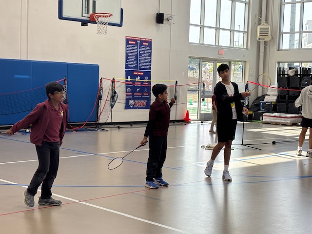Players practicing badminton at TMSA Elementary